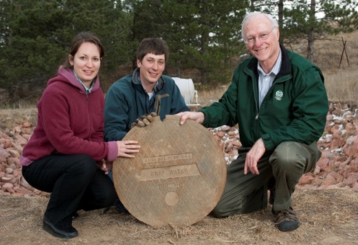 Sybil Sharvelle (left), Adam Jokerst (center) and Larry Roesner (right) pictured with graywater person hole located at CSU constructed wetlands for graywater treatment